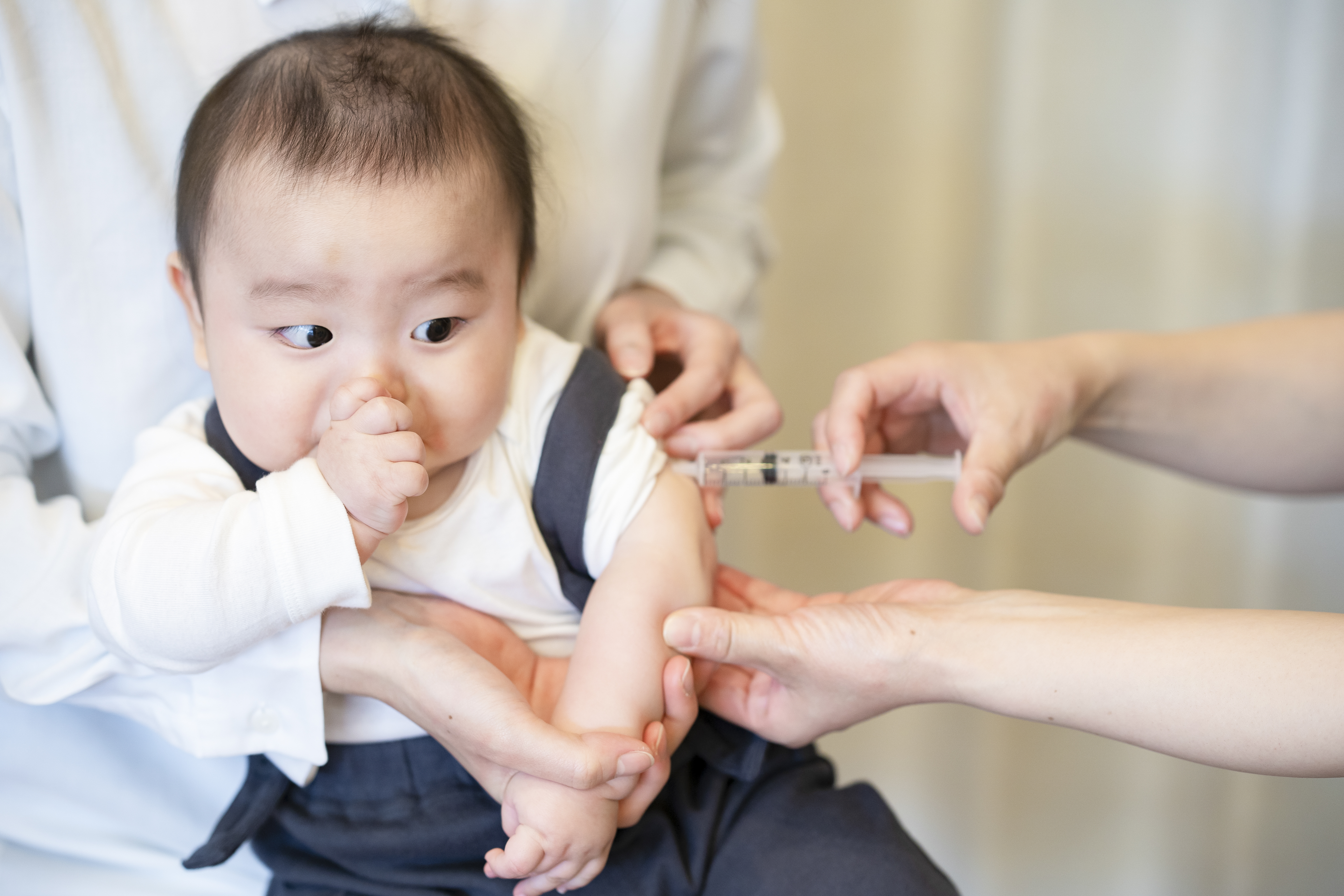 Baby receiving Speedoc's home-based vaccinations