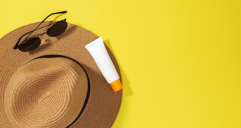 Sunscreen, sunglasses and sun hat for skin cancer protection