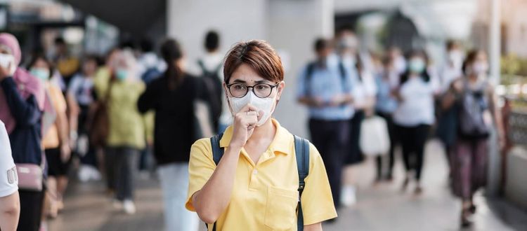 girl wearing a mask in public